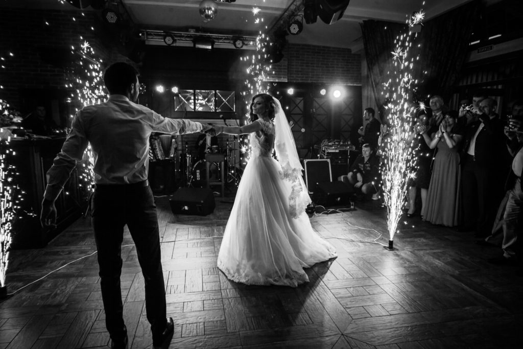 Newlywed couple performing their first dance with a live band